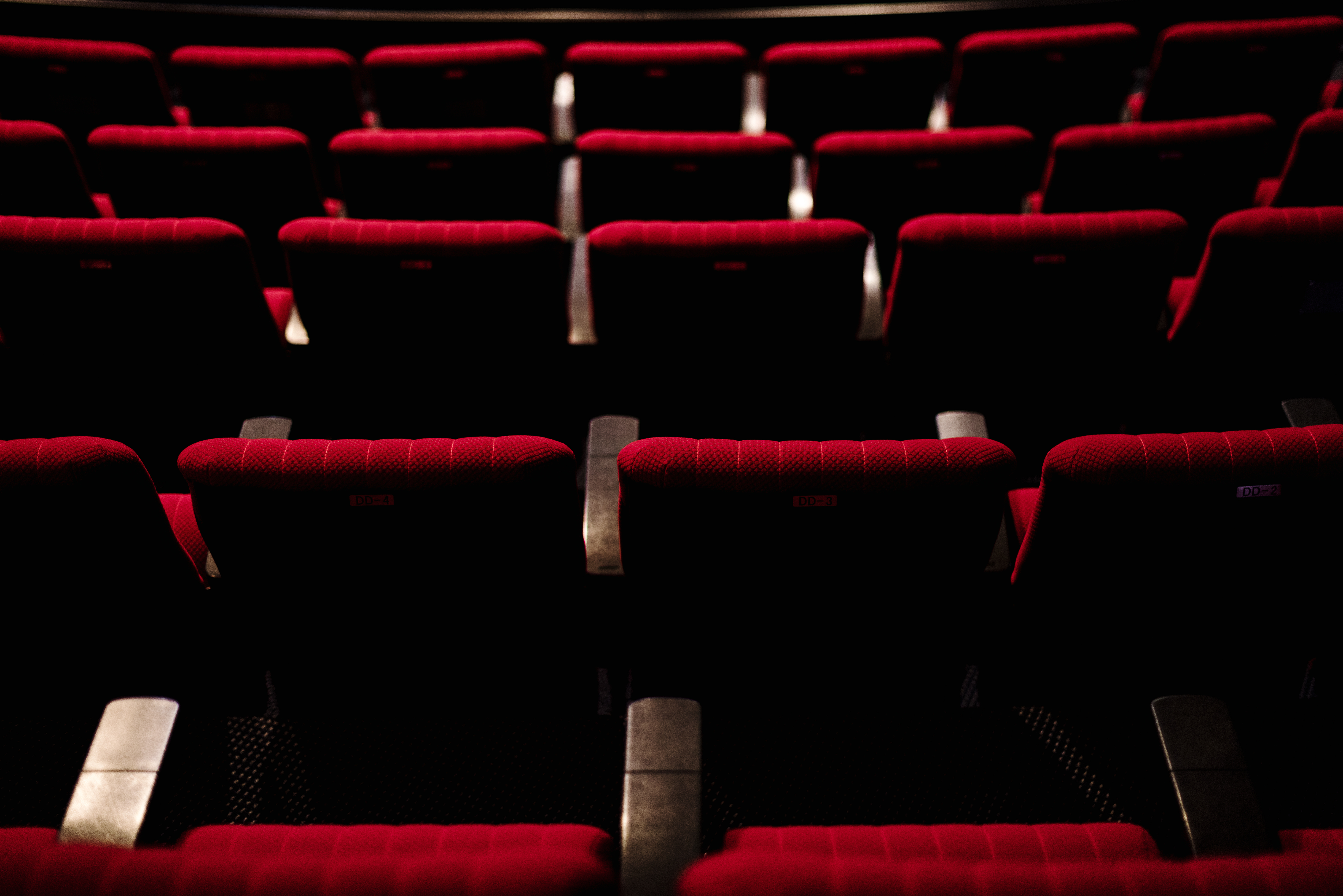 Cinema auditorium with red seats